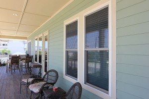 White Vinyl windows on blue condo porch in Pensacola FL